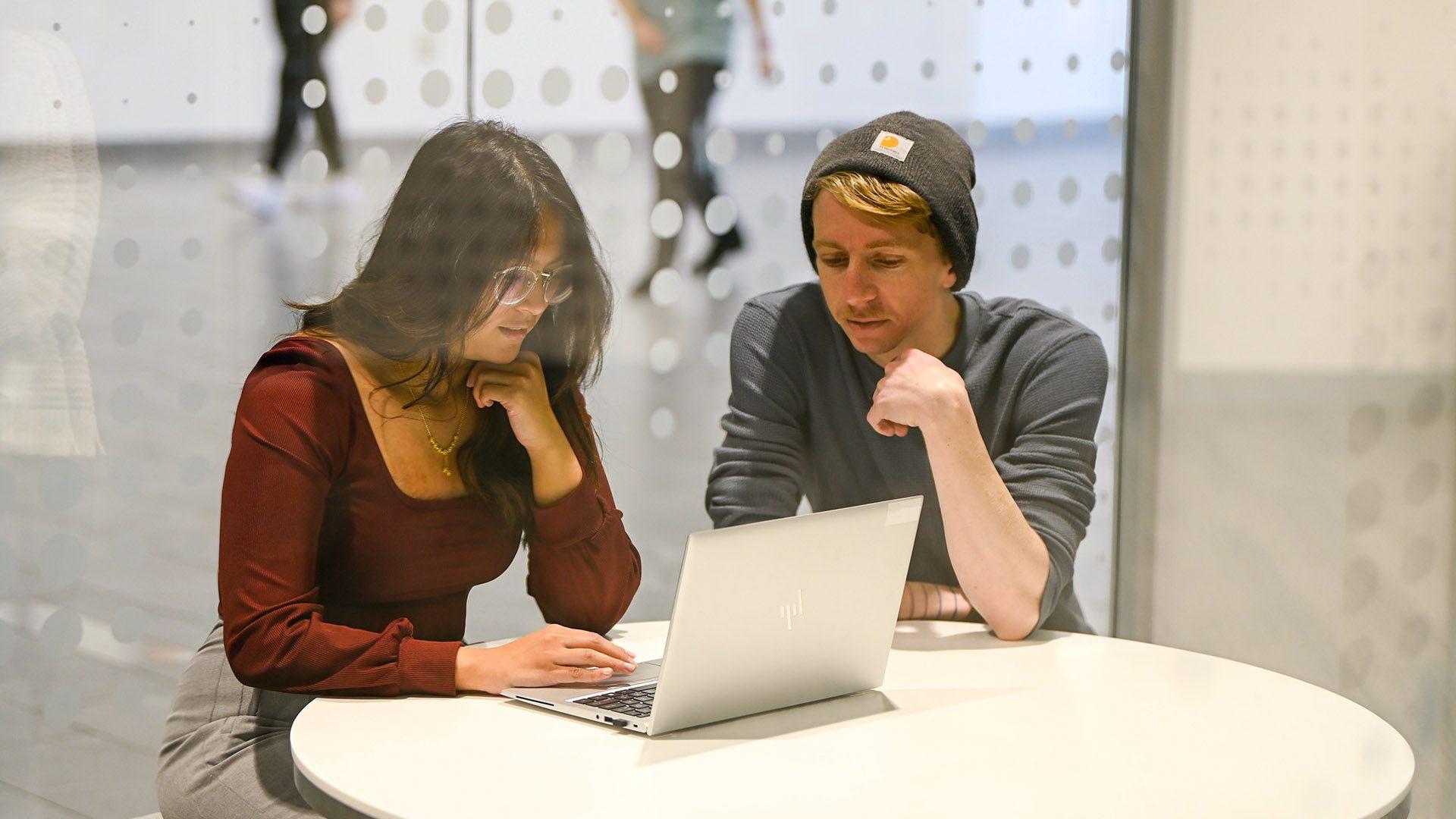 Interns working on laptop